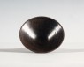 Black ware tea bowl with brown streaks (oblique)