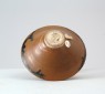 Black ware tea bowl with 'partridge feather' glazes (oblique)