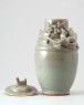 Greenware funerary jar and lid with dragon, bird, and a dog (oblique)