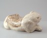 White ware pillow in the form of a lion (oblique)