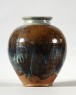 Black ware jar with blue splashes (oblique)