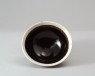 Black ware bowl with white rim (oblique)