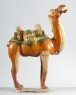 Figure of a camel with saddle in the form of an animal mask (oblique)