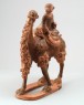 Figure of a camel carrying a young girl (oblique)